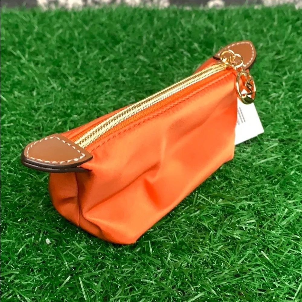 MICHAEL KORS TRAVEL XS POUCH TANGERINE